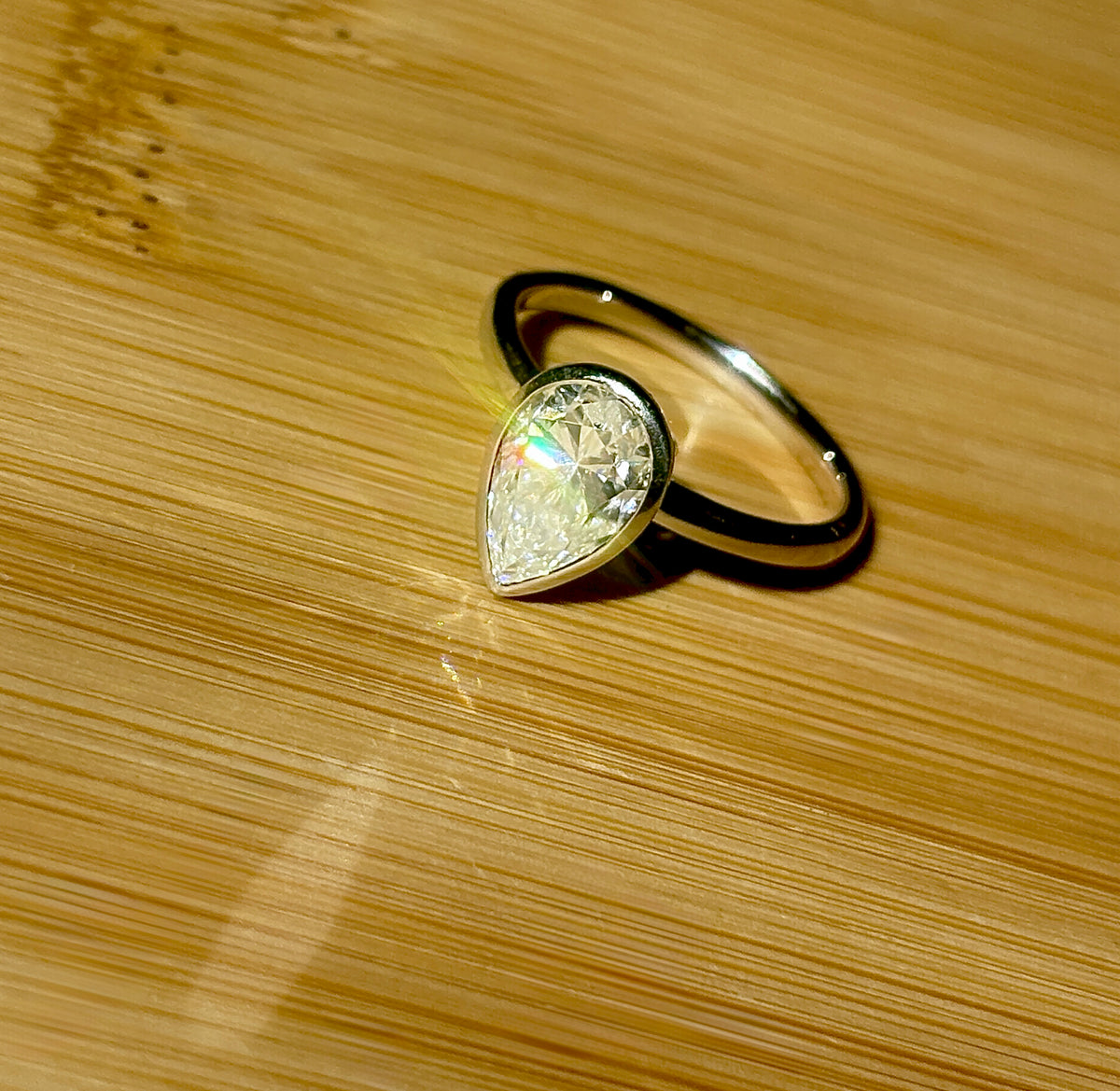 Moissanite ring. A certified 3ct pear in a hybrid basket + bezel of 925 sterling or 935 Argentium silver! A Hand Knotted Jewelry EXCLUSIVE!