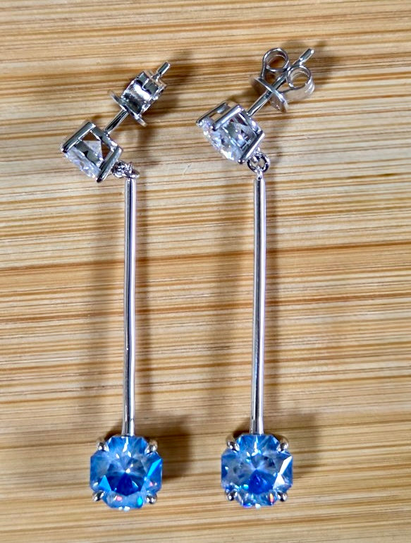 8ctw Moissanite pendulum earrings, with 3ct octagonal frosty aquamarine Moissanites at the bottom of the pendulum, and 1ct white round brilliant Moissanites at the top! Full Argentium silver construction with sterling silver disk backs! An HKJ exclusive!