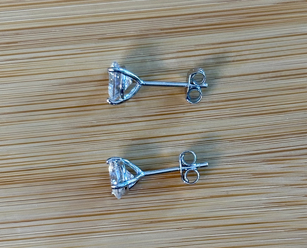 Moissanite studs. A 100-facet 2cttw pair of super bright, DOUBLE certified Moissanite studs in sterling silver and 18k white rhodium! Sublime!