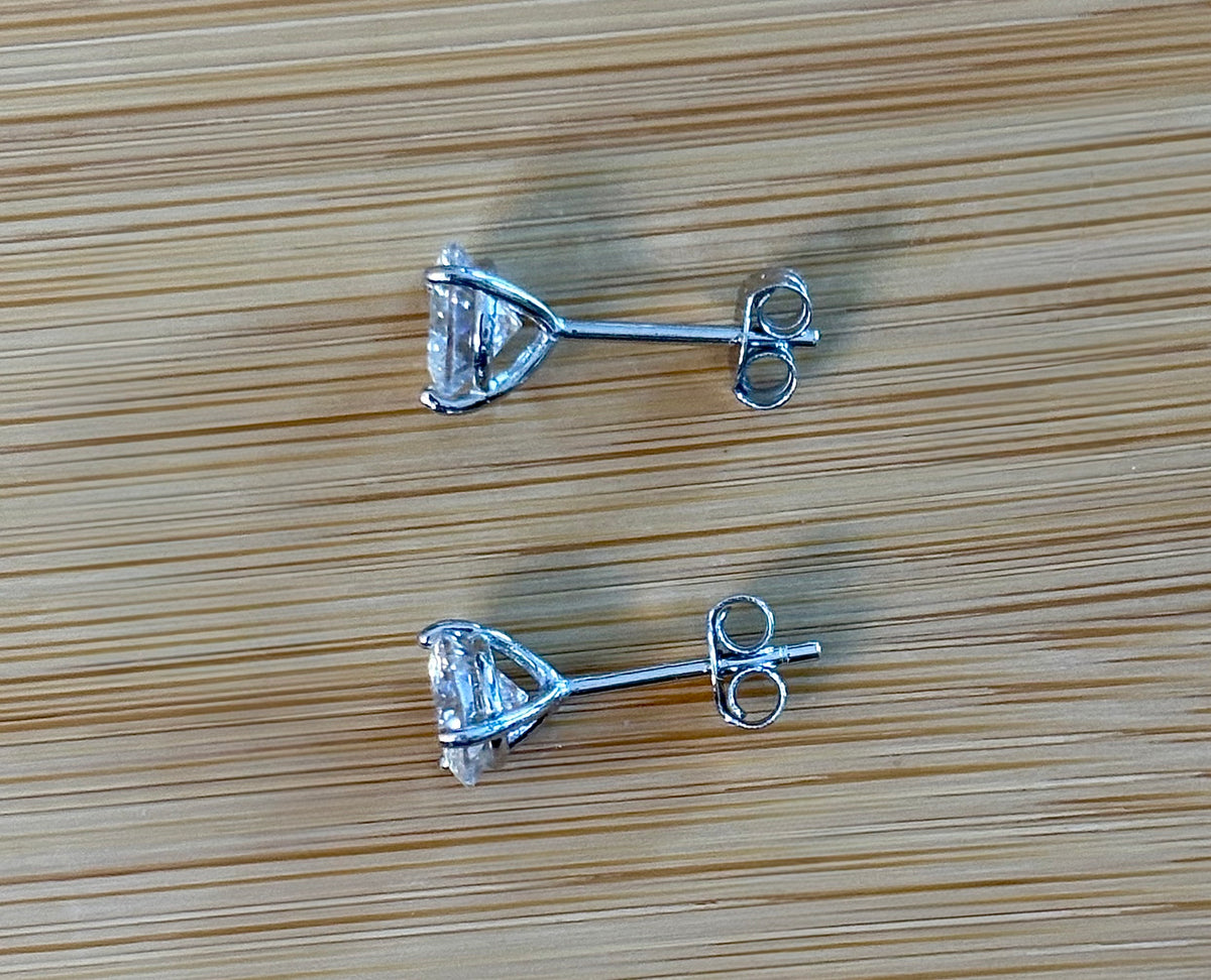 Moissanite studs. A 100-facet 2cttw pair of super bright, DOUBLE certified Moissanite studs in sterling silver and 18k white rhodium! Sublime!
