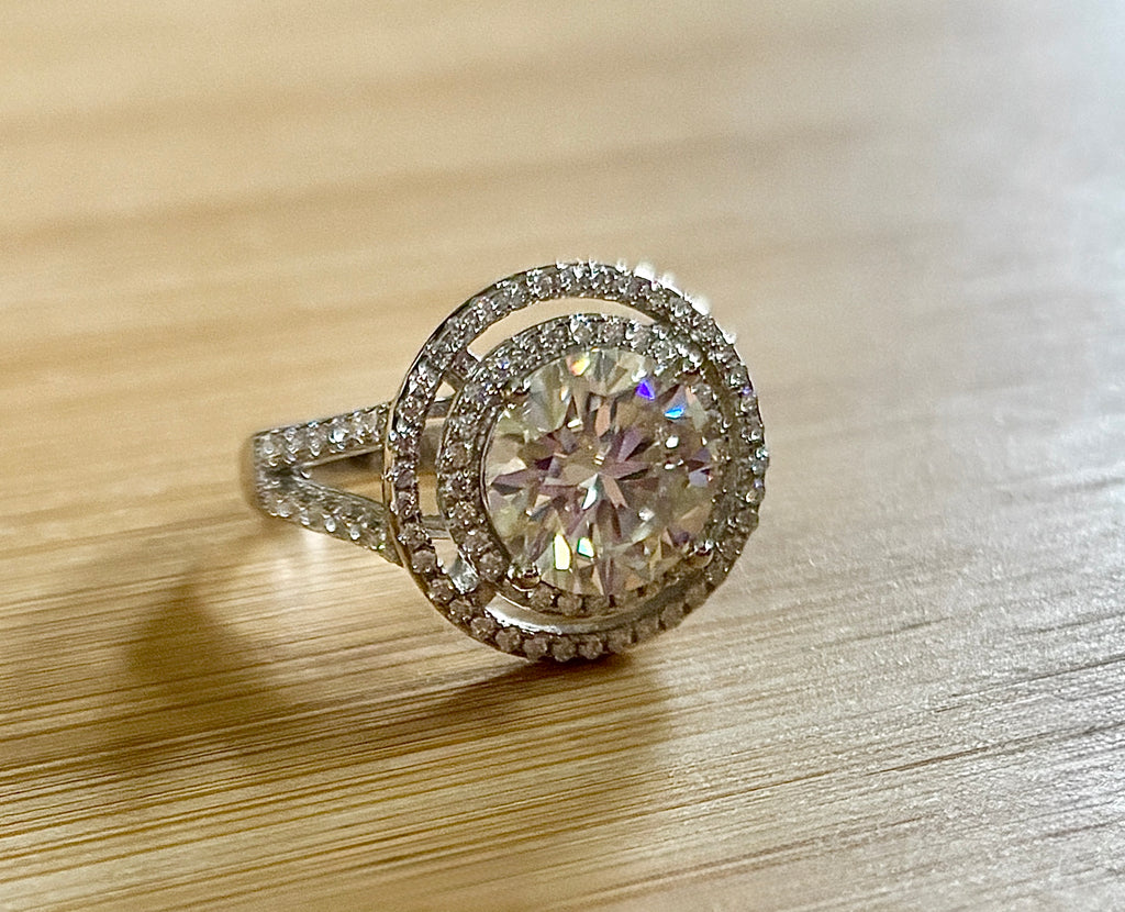 Moissanite ring. The 6.64cttw *fully* Moissanite “Bull’s Eye” ring, featuring a 4ct certified round brilliant Moissanite in a double halo!