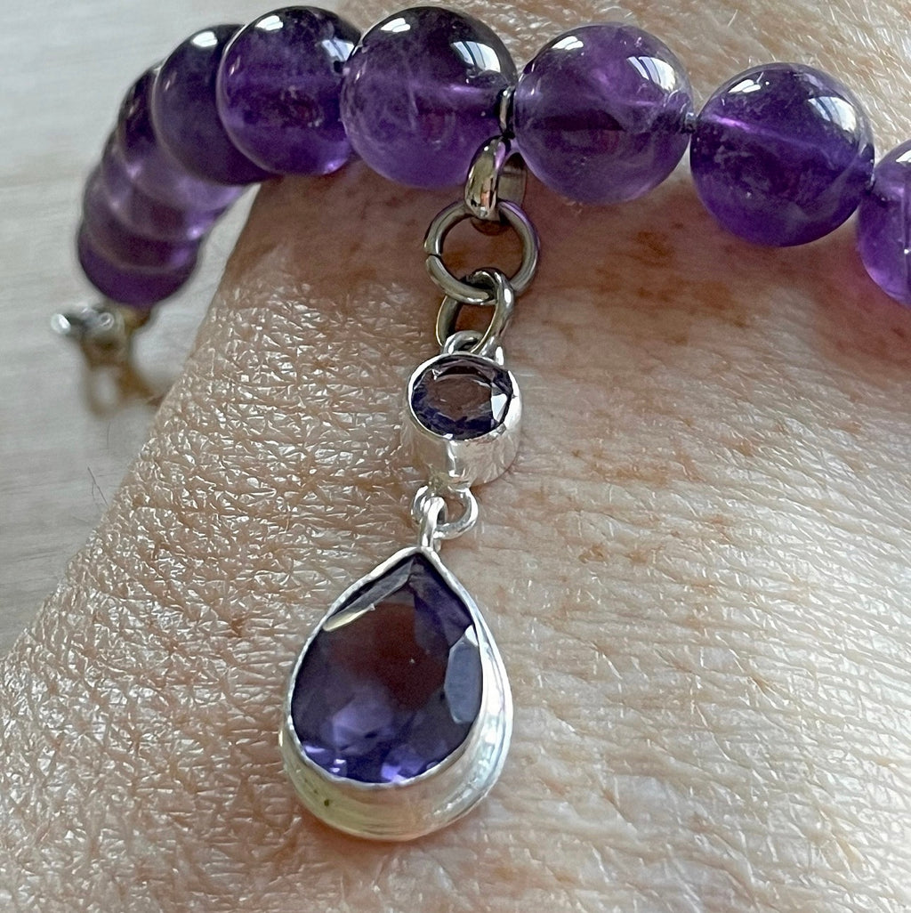 Amethyst bracelet. Natural and vibrant 10mm amethyst beads and stainless steel! The amethyst pendant in solid sterling silver is optional.