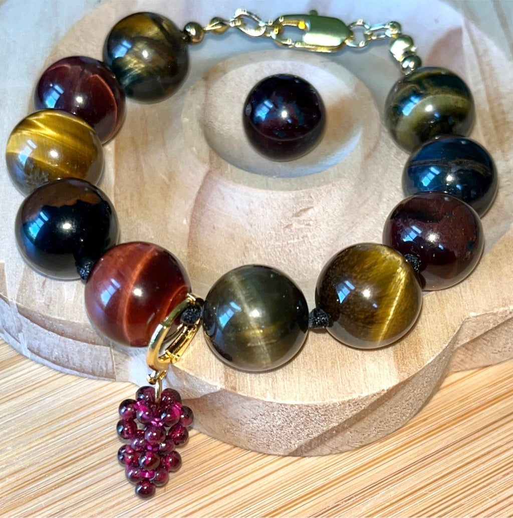 Tiger’s eye bracelet. 100% natural, highly chatoyant 14mm tricolored tiger’s eye hand knotted bracelet! Also available without the knots!
