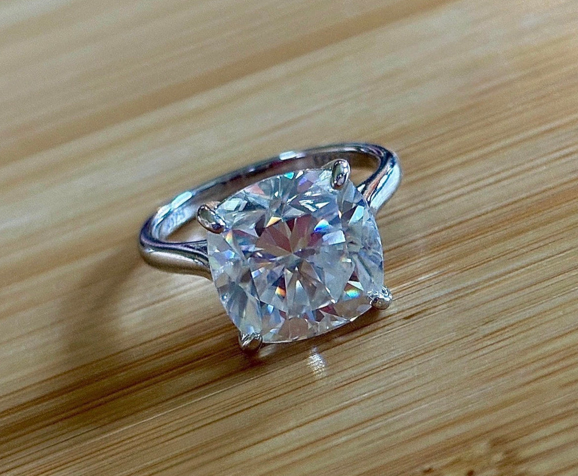A fiery 9ct certified CLASSIC cushion-cut Moissanite solitaire, the ring of a certain princess (ex-princess?), but without the royal price tag! So indulge!