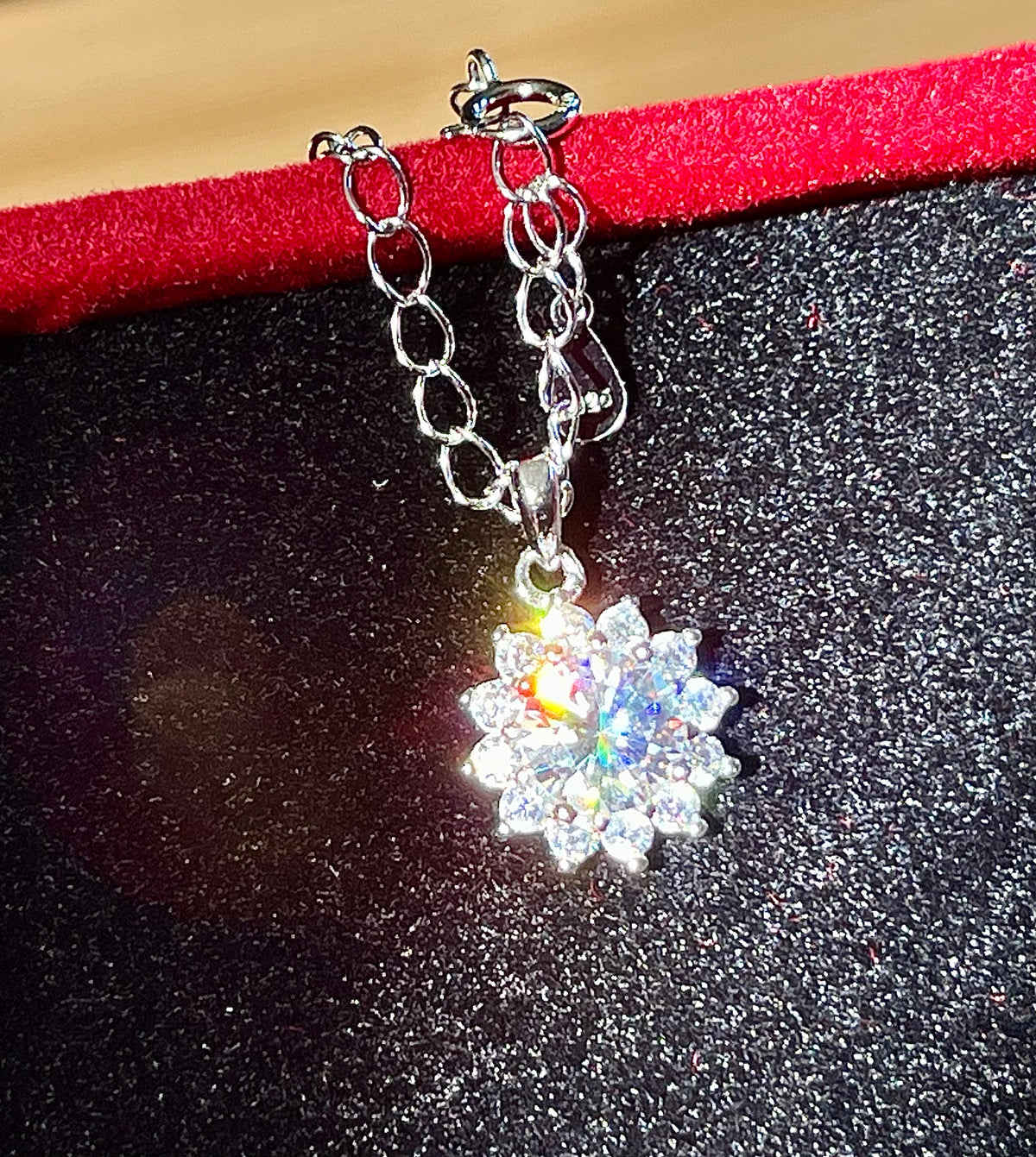 Moissanite necklace. A 1ct or 3ct Moissanite in a halo of sparkling white zircons (I call it the “Sunflower” pendant)! In sterling silver and 18k!