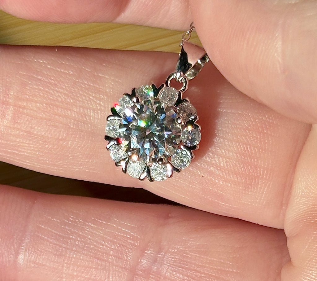 Moissanite necklace. A 3ct certified round brilliant Moissanite in a snowflake-shaped pendant ! A perfect piece for the holidays and beyond!