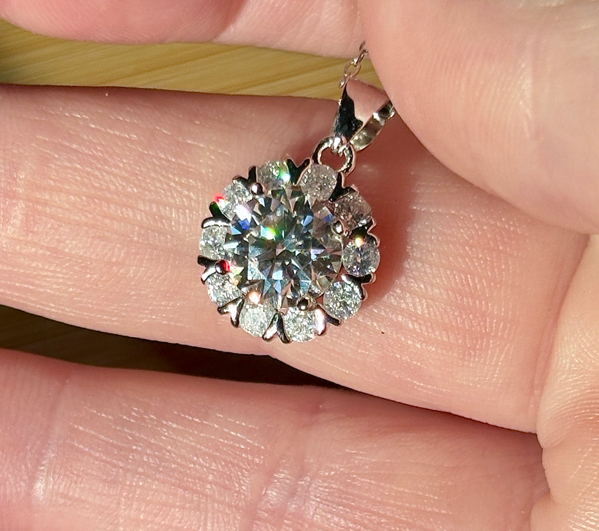 Moissanite necklace. A 3ct certified round brilliant Moissanite in a snowflake-shaped pendant ! A perfect piece for the holidays and beyond!