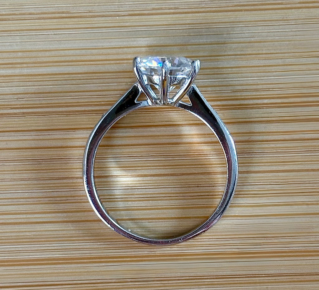 Moissanite ring. A delicious 3ct certified Moissanite solitaire with tapered shoulders and pavé-set white zircons in sterling and 18k gold!