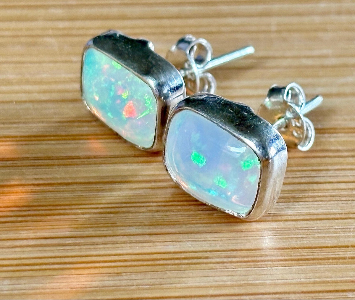 Ethiopian opal earrings, pair B. A beautiful pair of rectangular Ethiopian opal earrings, approximately 4cttw and hand-set in sterling silver bezels!