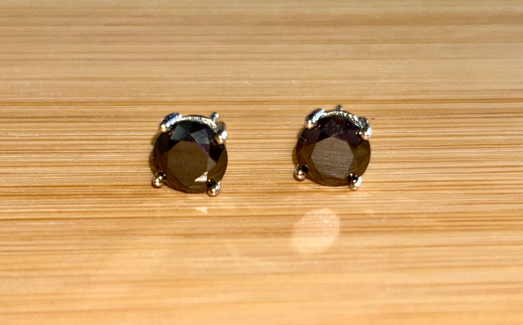 Moissanite studs. A 2cttw certified pair of black Moissanite studs in a sterling silver basket setting with 18k white gold plating!