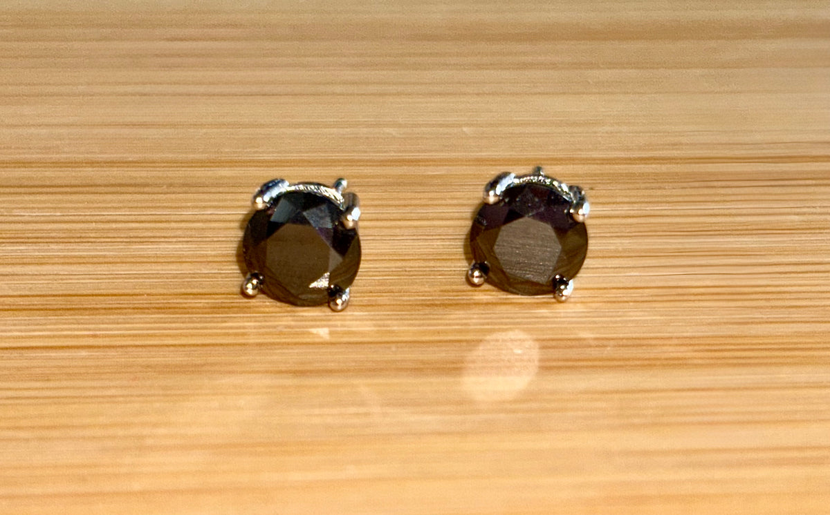 Moissanite studs. A 2cttw certified pair of black Moissanite studs in a sterling silver basket setting with 18k white gold plating!