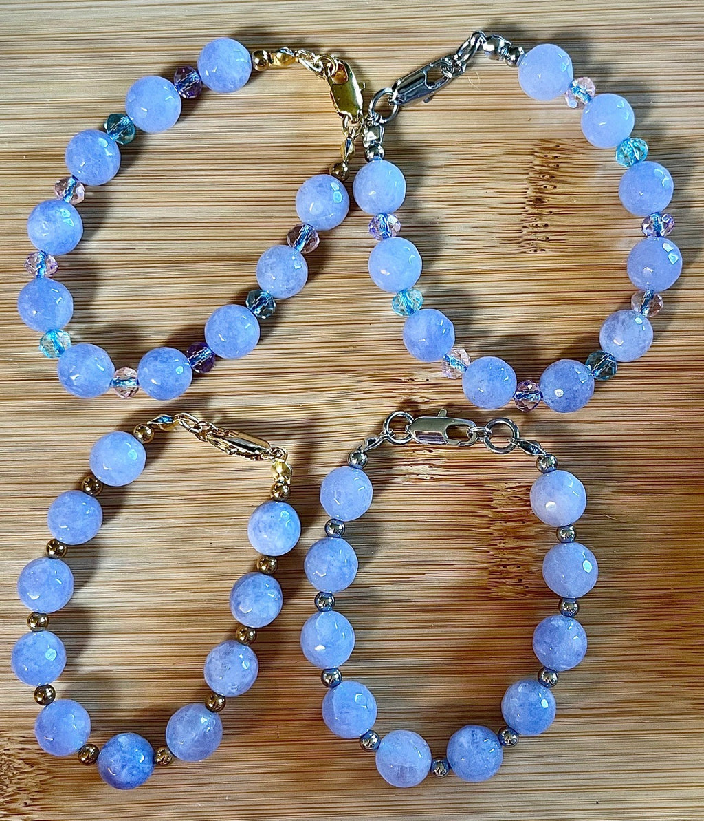 Aquamarine bracelets and/or earrings. Faceted 10mm aquamarines with your choice of crystal or stainless steel station beads and stainless steel color!