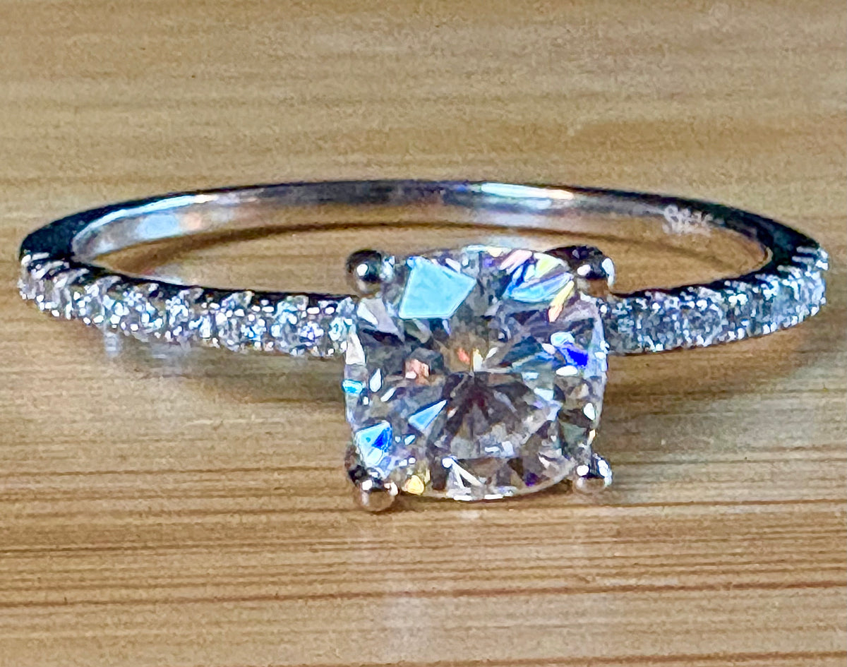 Moissanite solitaire. A certified 1ct cushion-cut Moissanite with pavé-set zircons in 925 sterling OR pavé-set Moissanites in 935 Argentium!