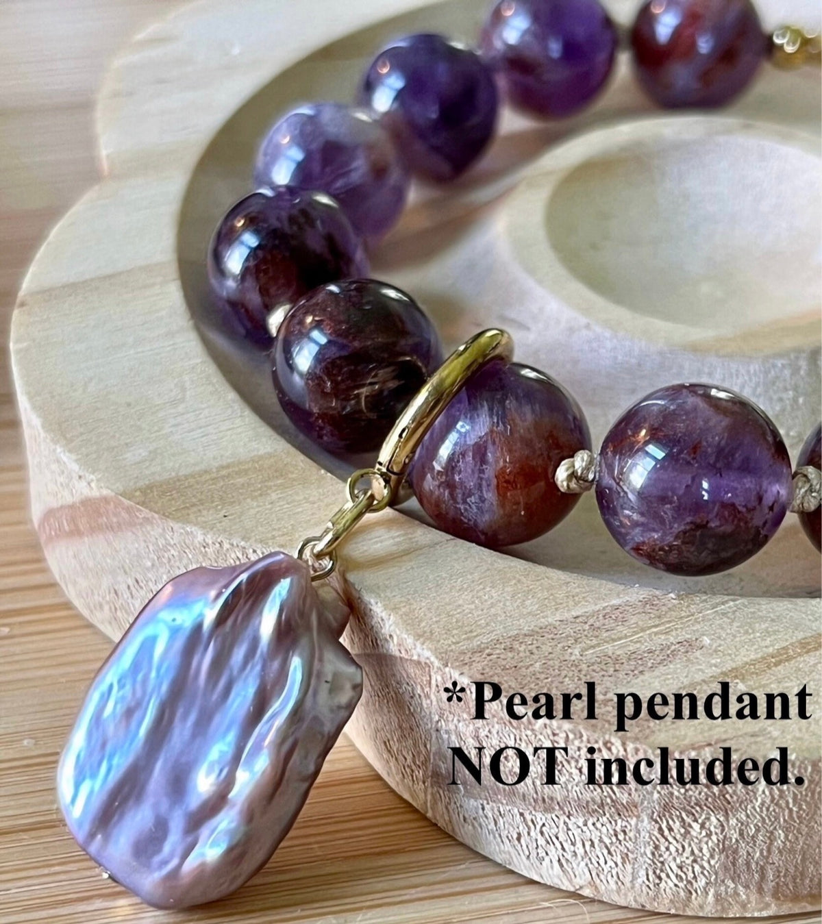 Super seven amethyst bracelet. AAA-grade 12mm “super seven”, mineral name cacoxenite amethyst, hand-knotted with silvery or golden hardware!