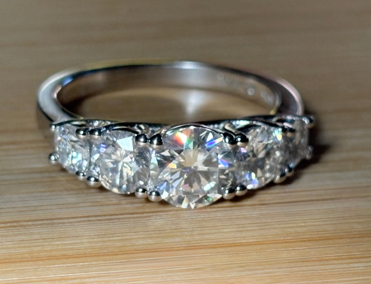 Moissanite ring. A 2.5ctw certified Moissanite ring, for those who want plenty of sparkle but a daintier ring! This feminine 5-stone design is just the thing!