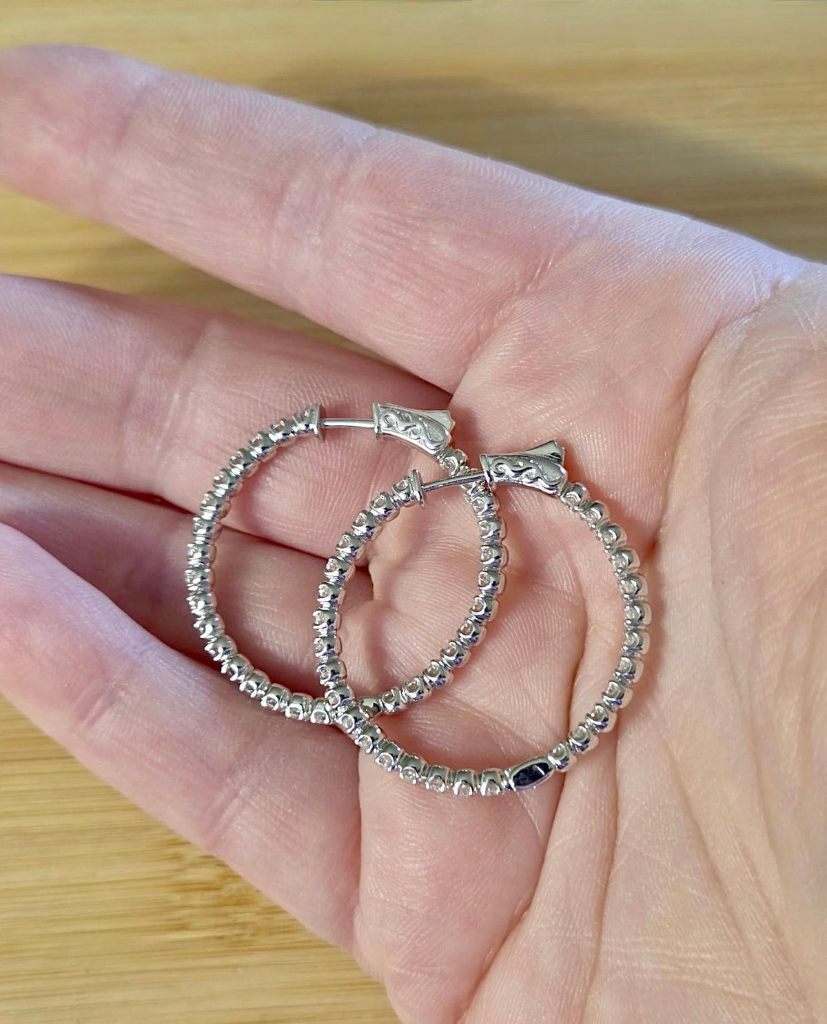 Moissanite hoops. These 1.8ctw Moissanite inside-out hoops *lock* in place so you can take your style from the office to the dance floor! So boogie down!