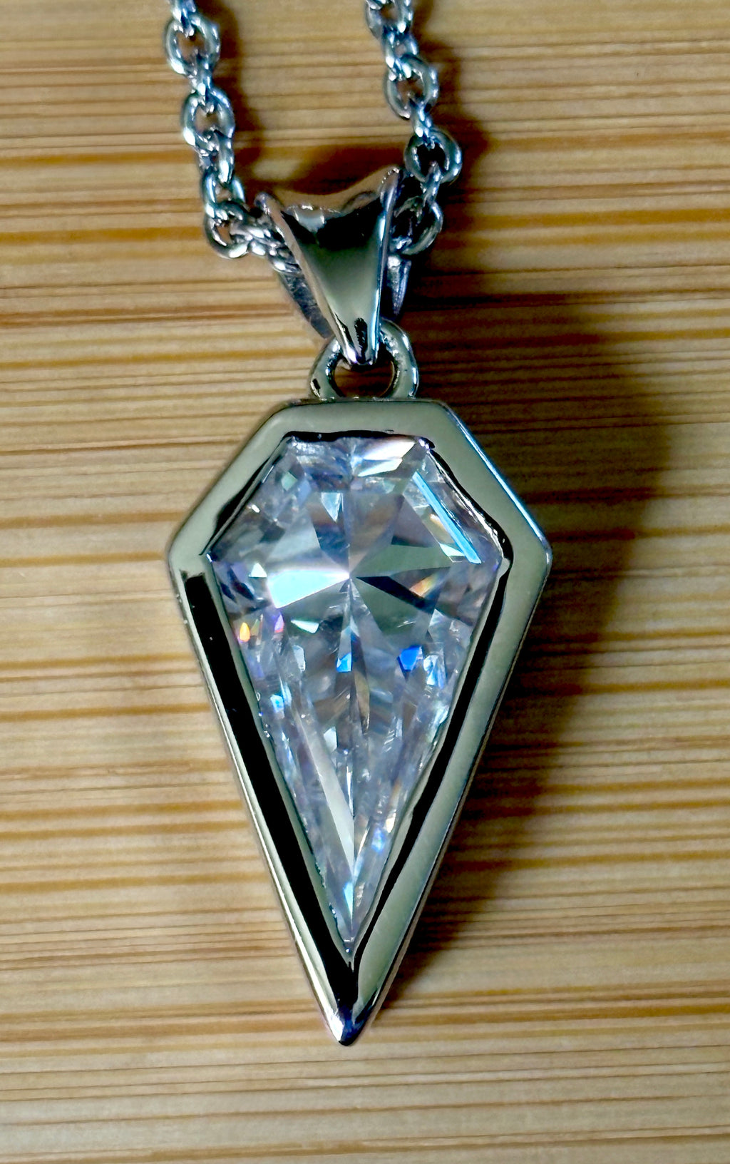 Moissanite necklace. “Flight!”, a kite-shaped, custom-cut 5ct Moissanite pendant! Hand-faceted by a master stone cutter and set in Argentium silver, it is suspended on a 20” sterling silver chain and is exclusive to Hand Knotted Jewelry!
