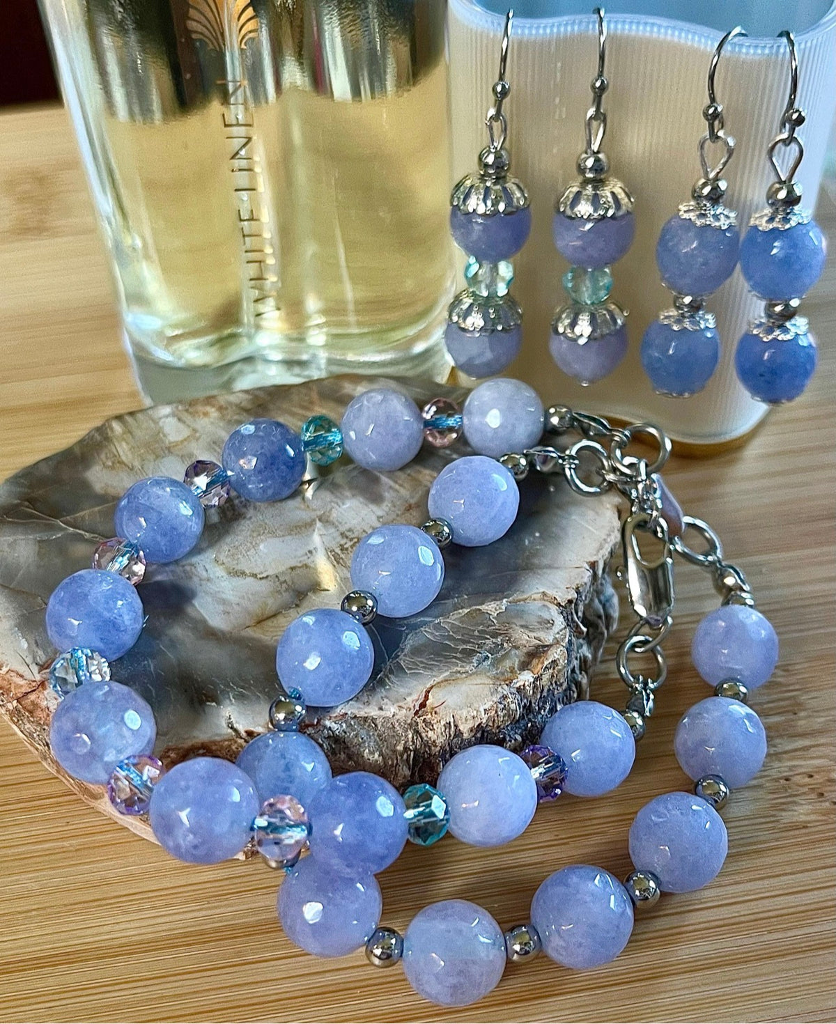 Aquamarine bracelets and/or earrings. Faceted 10mm aquamarines with your choice of crystal or stainless steel station beads and stainless steel color!