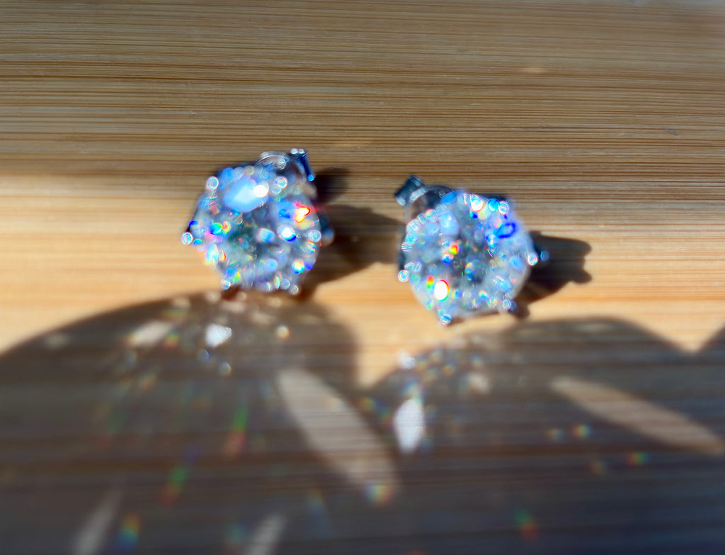 A 10ctw pair of double certified Moissanite studs in lotus-shaped sterling silver baskets!