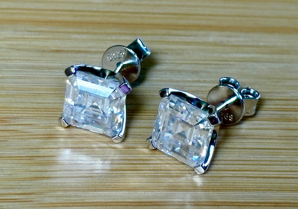Moissanite studs. A 6.4ctw *perfect* pair of DOUBLE certified Asscher-cut Moissanites in my custom 4-claw 935 ARGENTIUM silver mountings! Opulent!