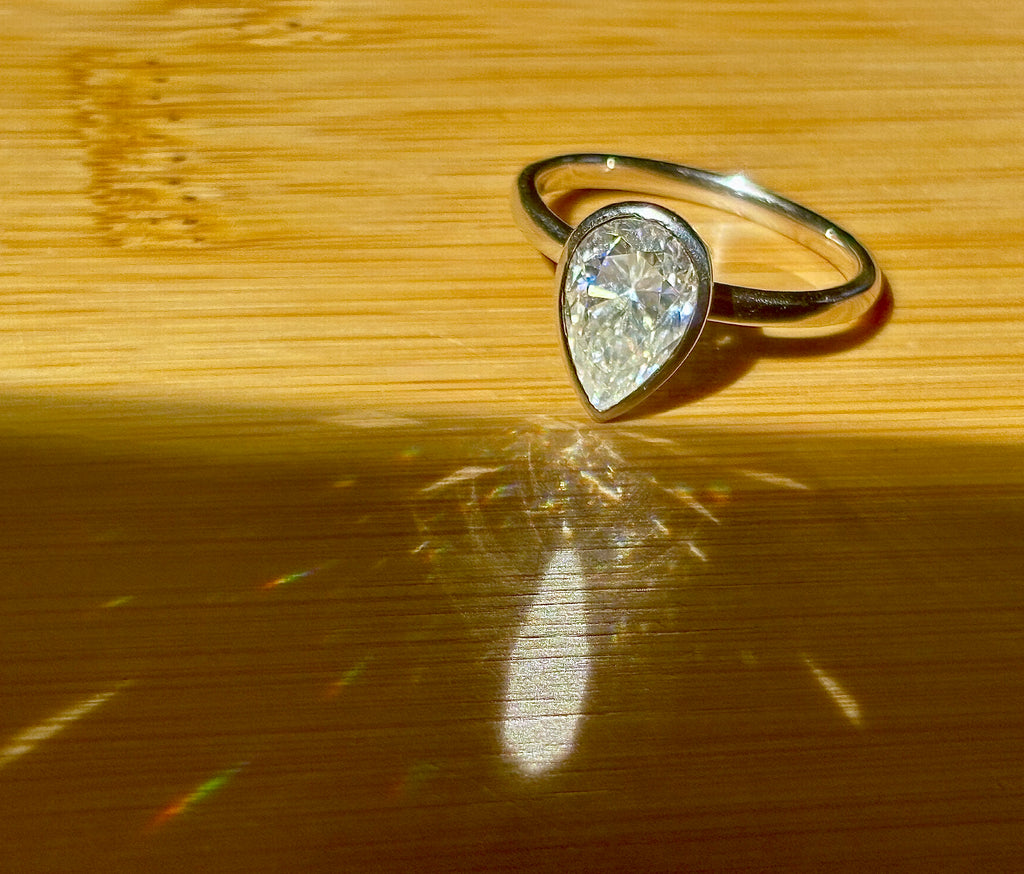 Moissanite ring. A certified 3ct pear in a hybrid basket + bezel of 925 sterling or 935 Argentium silver! A Hand Knotted Jewelry EXCLUSIVE!