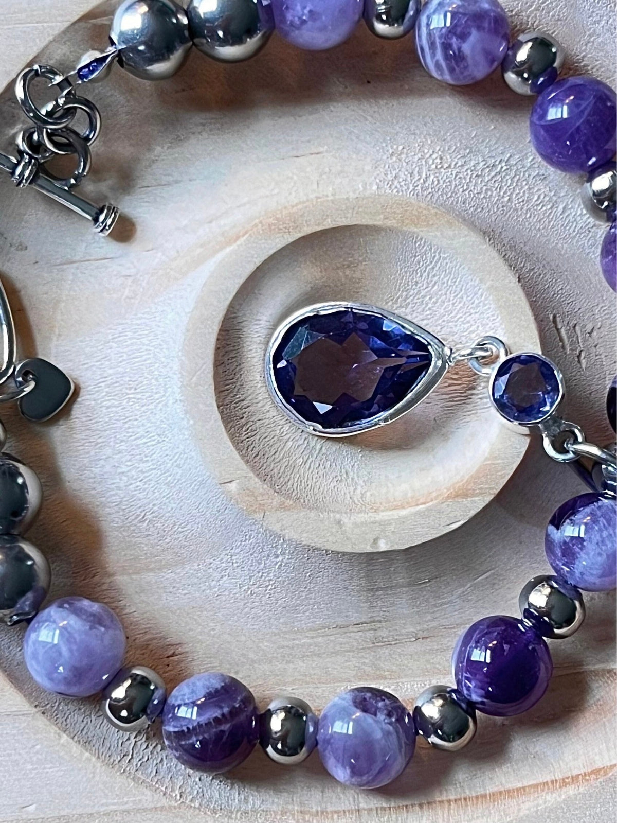 Amethyst bracelet. Pretty purple amethysts with chevron pattern crystallization! 8mm beads with durable stainless steel bracelet hardware!