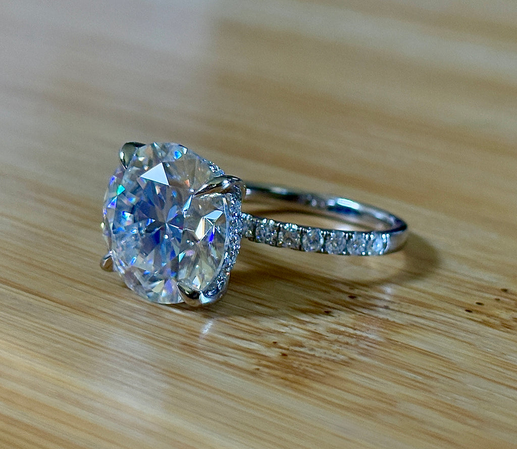 Moissanite solitaire. A glorious 10ct 8H8A Moissanite in a 4-prong mounting with a Moissanite “hidden halo” and shoulders, an 11.3cttw ring!