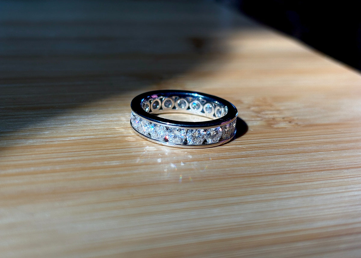 Moissanite ring. A 5.10cttw or 4.8cttw (depending on size) Moissanite eternity ring. A channel-set, classy and classic design - beautiful!