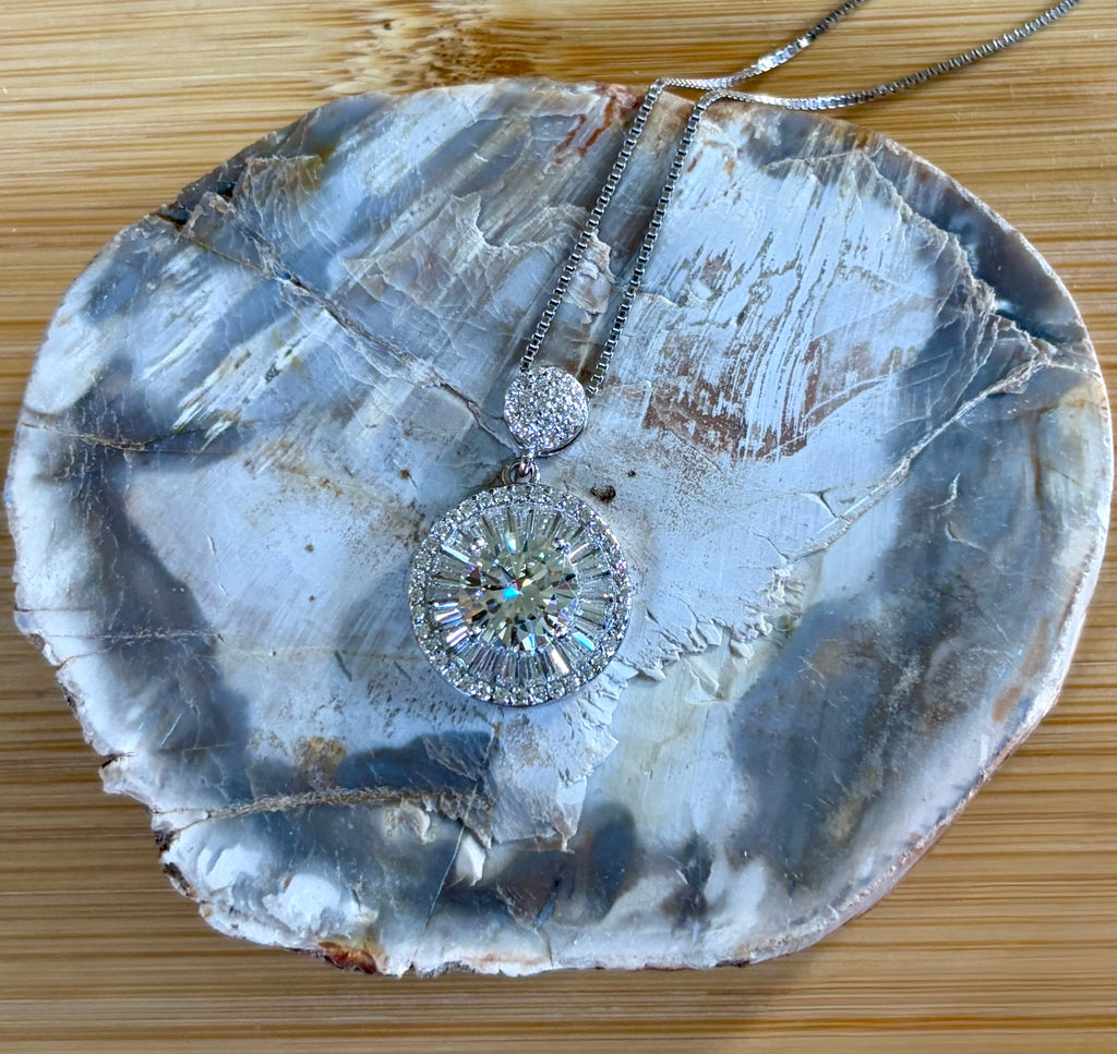 Moissanite necklace. The certified 2ct Moissanite “Sunburst” necklace with a 61 gemstone pendant plus more in the bail! Radiantly beautiful!