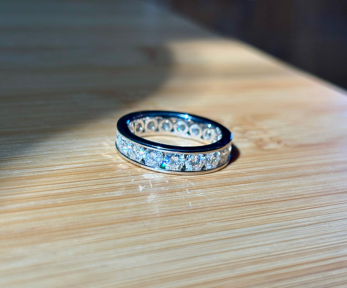 Moissanite ring. A 5.10cttw or 4.8cttw (depending on size) Moissanite eternity ring. A channel-set, classy and classic design - beautiful!