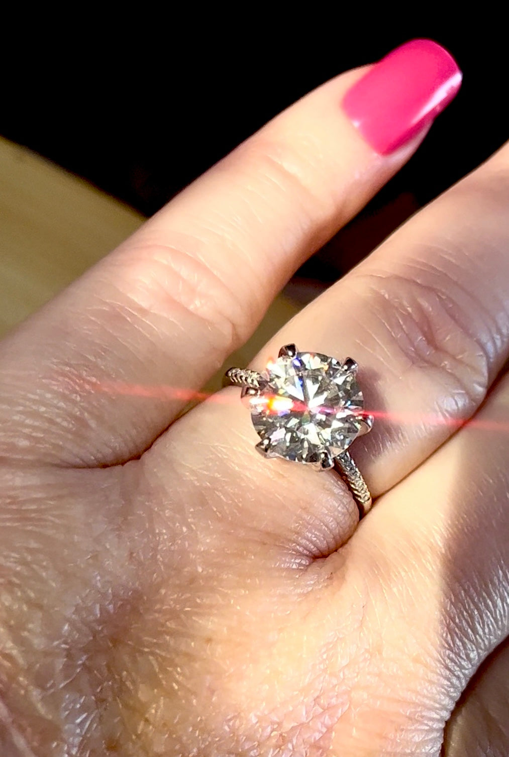Moissanite ring. A certified 5ct Moissanite solitaire with zircon-accented shoulders, set in sterling silver and bathed in 18k!