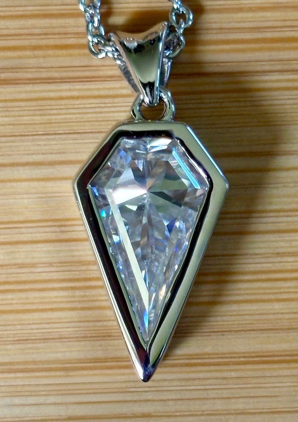 Moissanite necklace. “Flight!”, a kite-shaped, custom-cut 5ct Moissanite pendant! Hand-faceted by a master stone cutter and set in Argentium silver, it is suspended on a 20” sterling silver chain and is exclusive to Hand Knotted Jewelry!