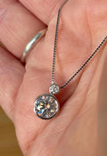 Moissanite necklace. A bright 2.1ctw certified Moissanite bezel pendant, with a 18” box chain and lobster claw clasp in sterling silver!