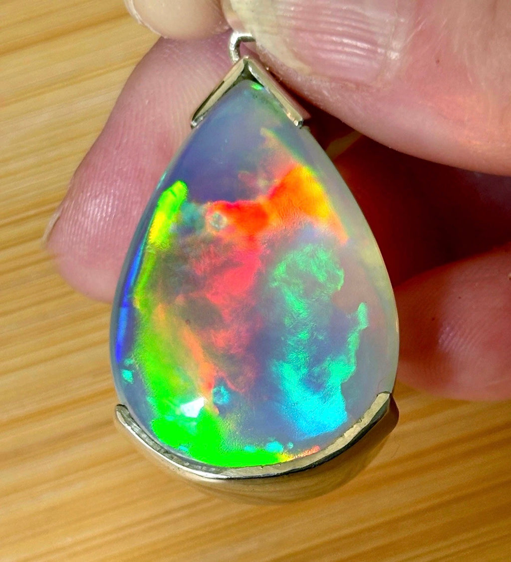 The “After the Storm” Ethiopian opal pendant, 39.18ct with rare “rolling” fire and spectacular play of color! **Collector’s grade** AAAA++