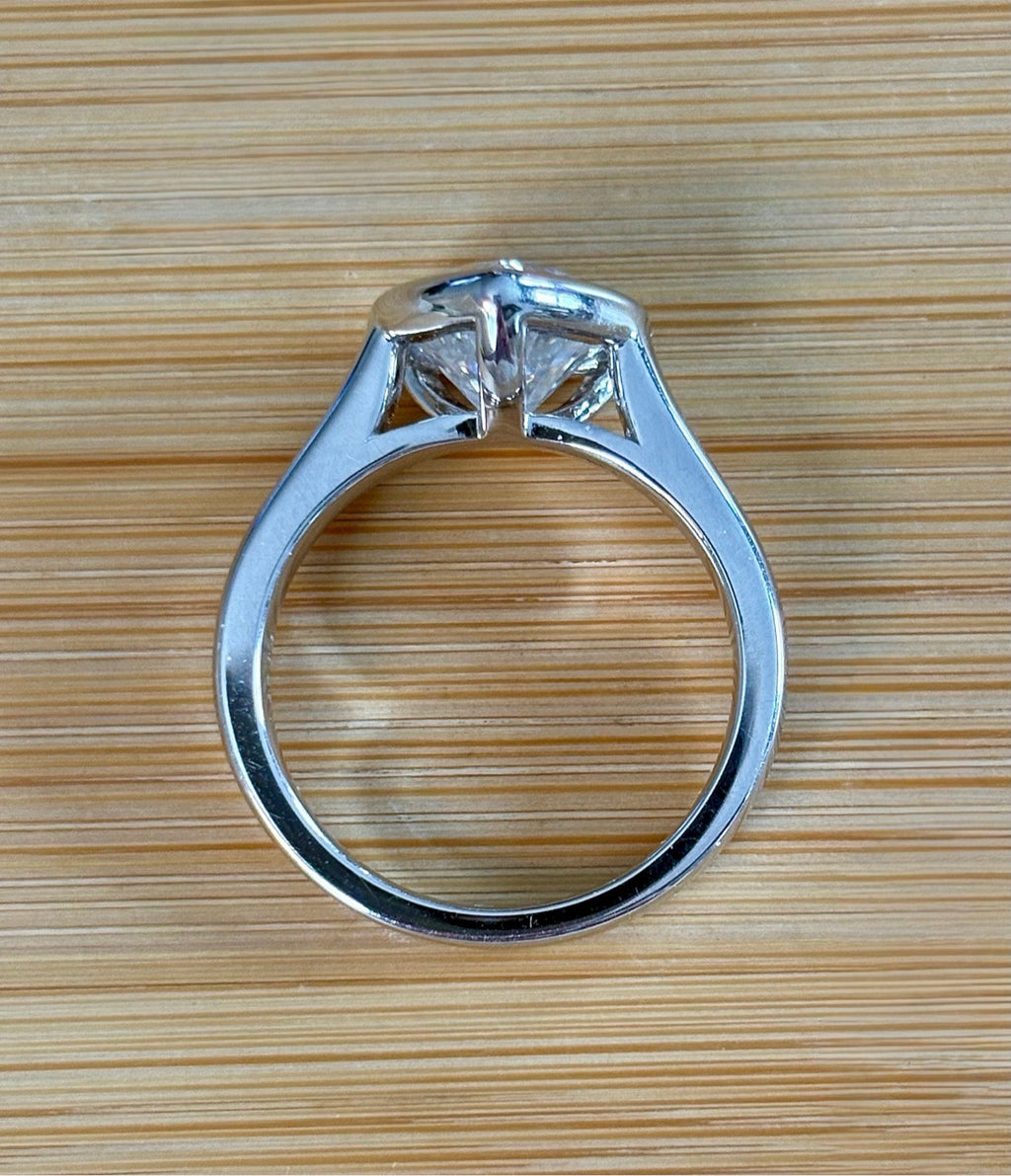 Moissanite ring. A high-end solitaire with a certified 3ct heart-cut stone, bezel-set in a heavy sterling silver mounting and bathed in 18k!