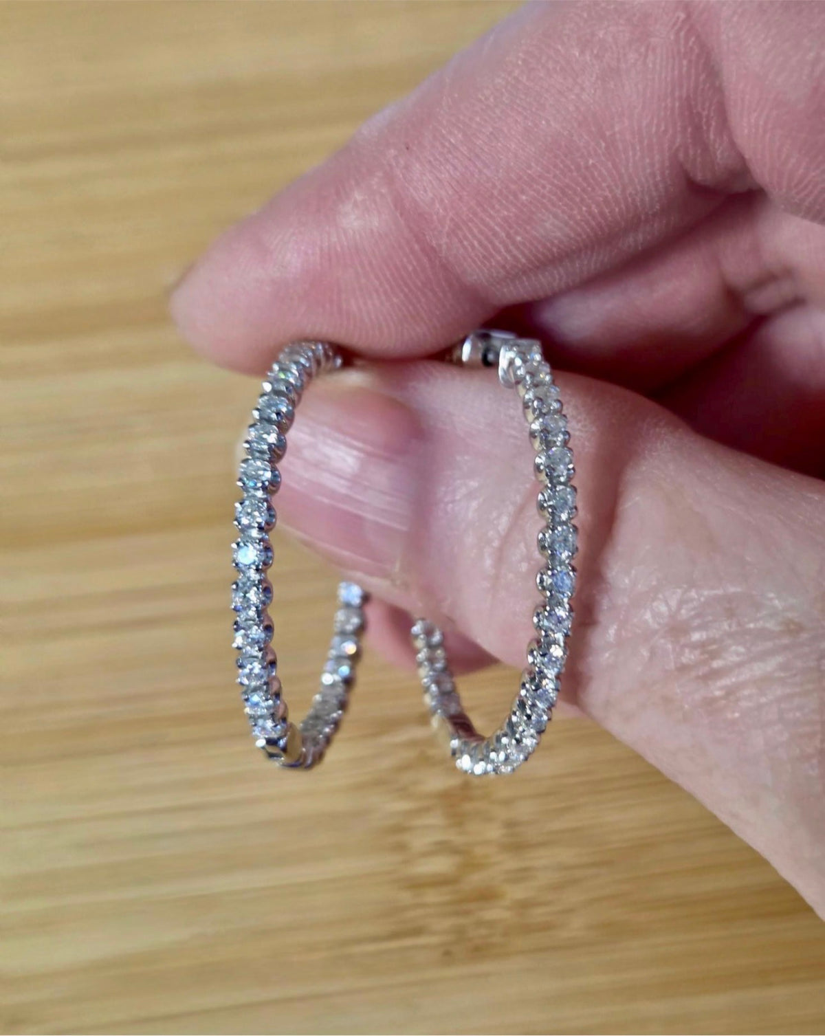 Moissanite hoops. These 1.8ctw Moissanite inside-out hoops *lock* in place so you can take your style from the office to the dance floor! So boogie down!