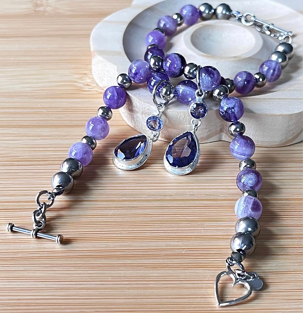Amethyst bracelet. Pretty purple amethysts with chevron pattern crystallization! 8mm beads with durable stainless steel bracelet hardware!