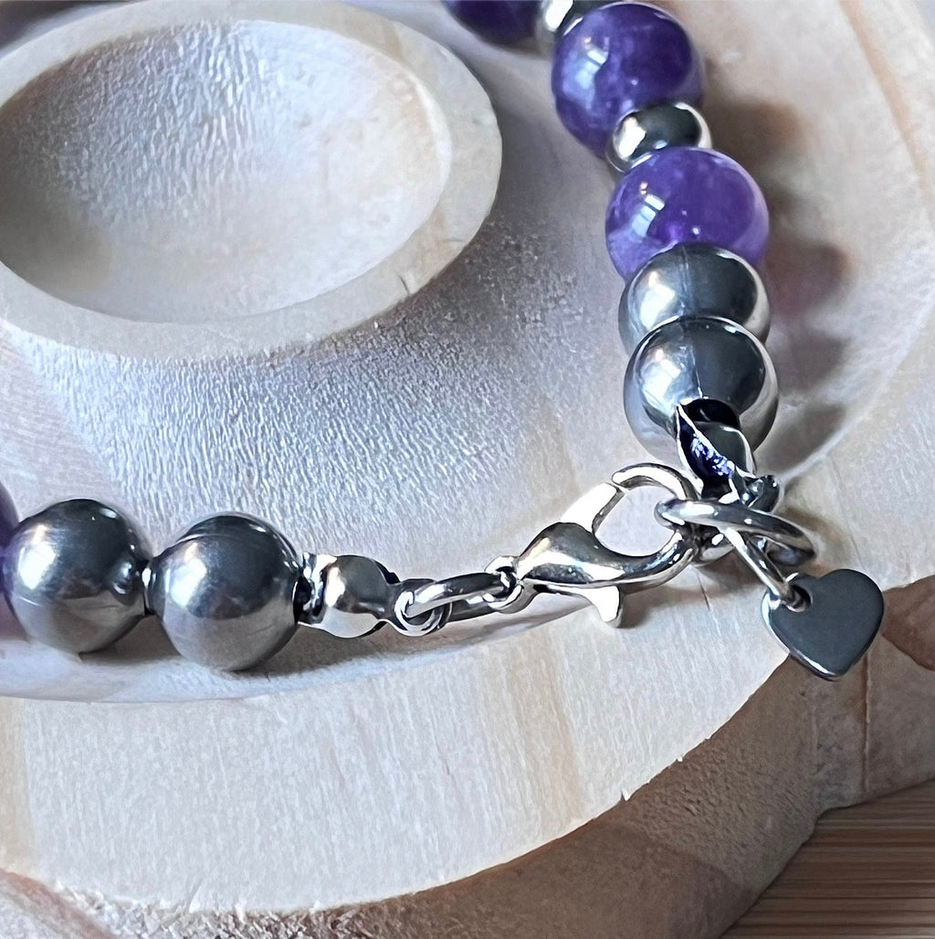 Amethyst bracelet. Pretty purple amethysts with chevron pattern crystallization! 8mm beads with durable stainless steel bracelet hardware!