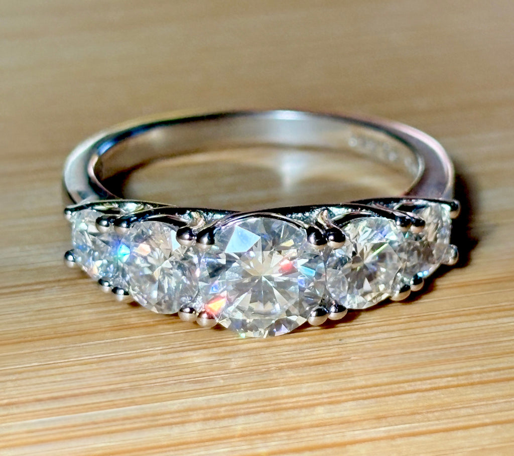 Moissanite ring. A 2.5ctw certified Moissanite ring, for those who want plenty of sparkle but a daintier ring! This feminine 5-stone design is just the thing!
