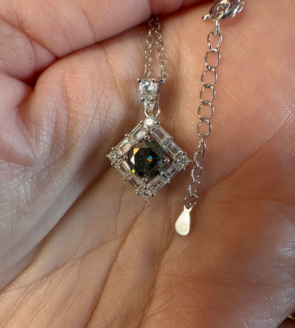 Moissanite necklace. A transfixingly gray 1ct certified round brilliant Moissanite centered in a halo of white zircons - a 2.25cttw pendant!