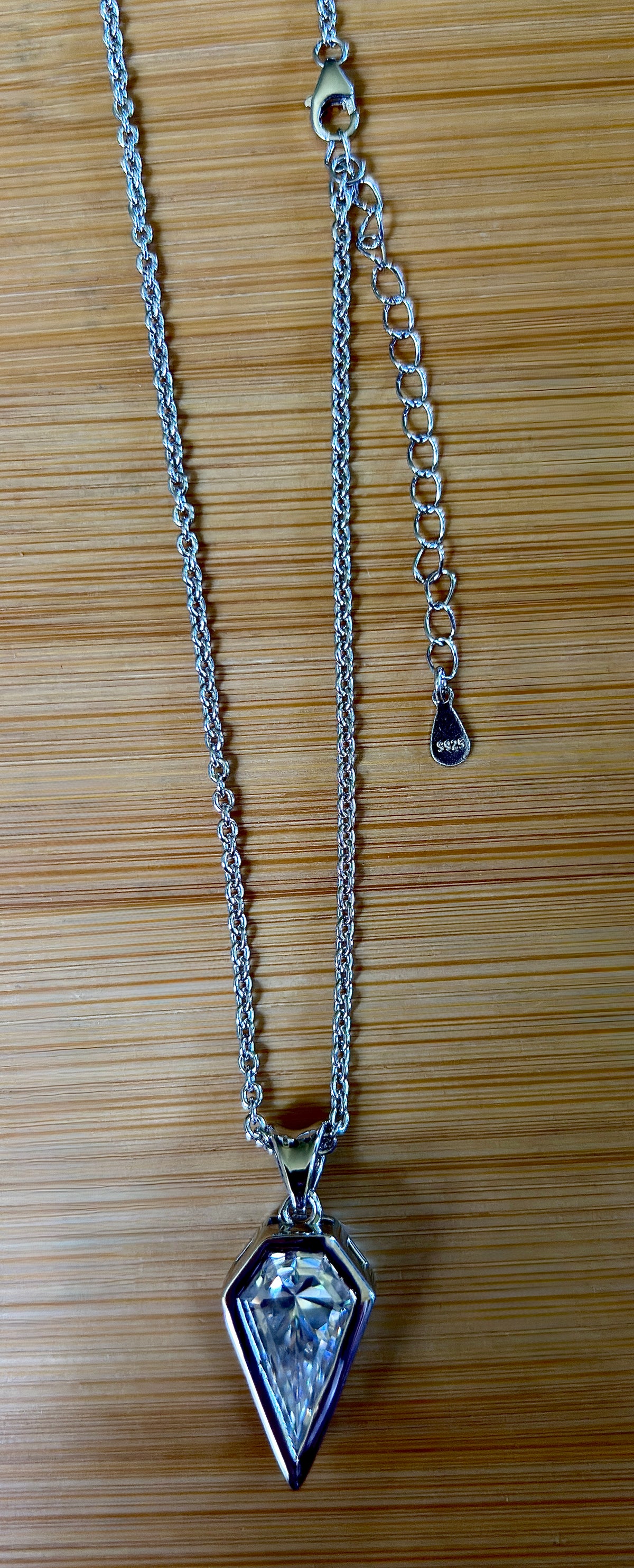 Moissanite necklace. “Flight!”, a kite-shaped, custom-cut 5ct Moissanite pendant! Hand-faceted by a master stone cutter and set in Argentium silver, it is suspended on a 20” sterling silver chain and is exclusive to Hand Knotted Jewelry!