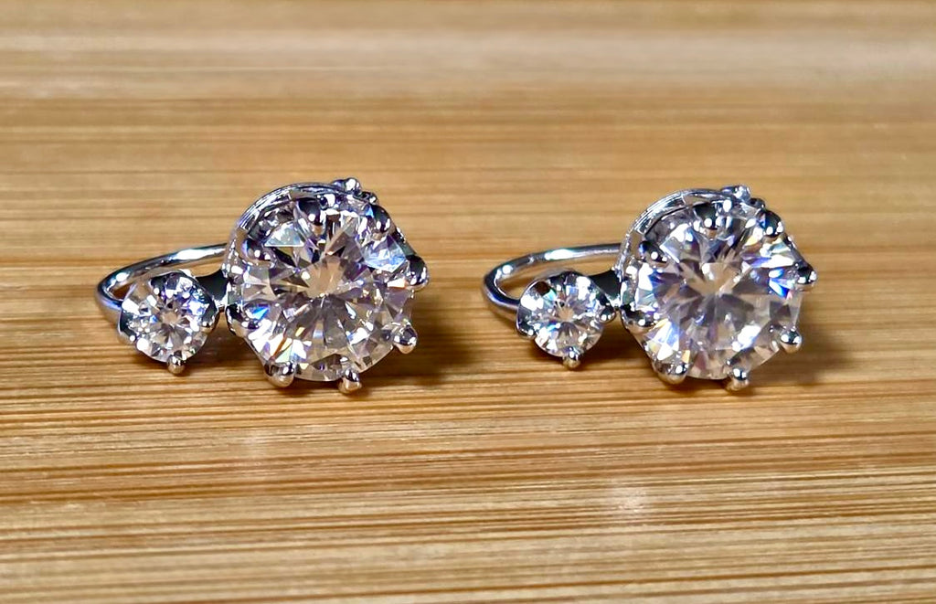 A Victorian inspired 4.2cttw certified pair of Moissanite 2-stone buckle back earrings in Argentium silver! Minimalist glam!