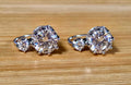 A Victorian inspired 4.2cttw certified pair of Moissanite 2-stone buckle back earrings in Argentium silver! Minimalist glam!