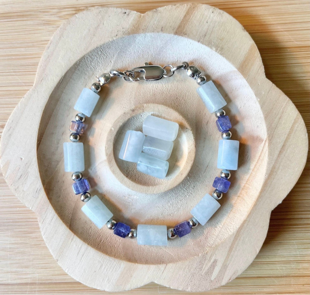 Aquamarine and tanzanite bracelet. The “True Blue” bracelet features trendy aquamarine barrels and dusky tanzanite cubes!