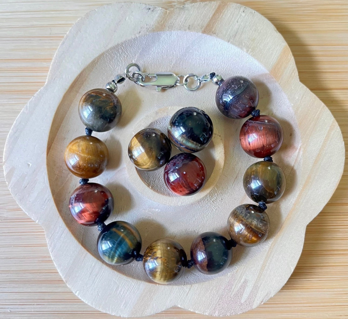 Tiger’s eye bracelet. 100% natural, highly chatoyant 14mm tricolored tiger’s eye hand knotted bracelet! Also available without the knots!