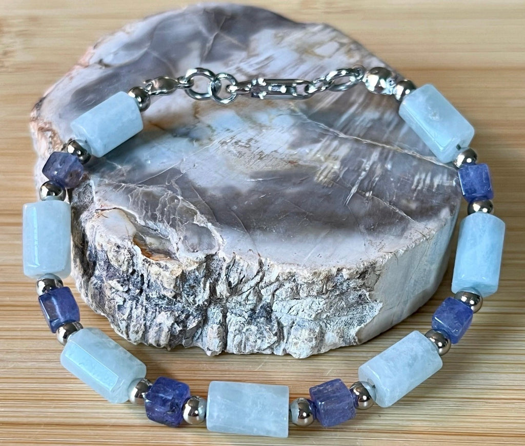Aquamarine and tanzanite bracelet. The “True Blue” bracelet features trendy aquamarine barrels and dusky tanzanite cubes!