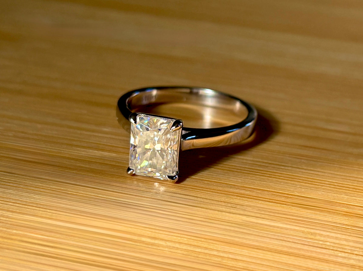 A certified Moissanite 3ct radiant solitaire! An UBER flashy, ULTRA classy, contemporary and chic radiant-cut engagement ring!