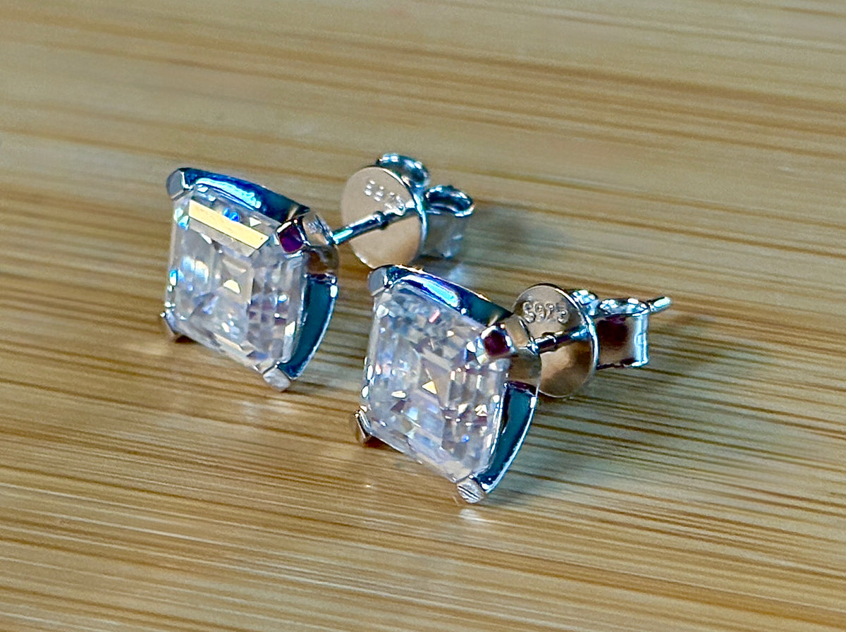 Moissanite studs. A 6.4ctw *perfect* pair of DOUBLE certified Asscher-cut Moissanites in my custom 4-claw 935 ARGENTIUM silver mountings! Opulent!