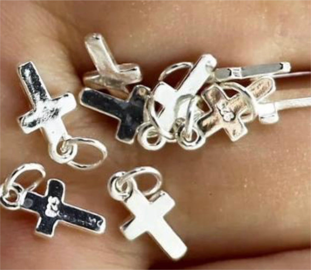 Small sterling silver cross charms, stainless steel double lobster clasps and stainless steel S-hooks for various jewelry applications.