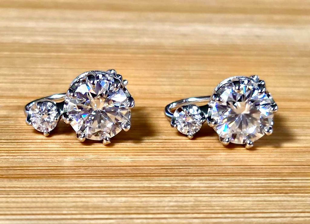 A Victorian inspired 4.2cttw certified pair of Moissanite 2-stone buckle back earrings in Argentium silver! Minimalist glam!
